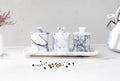 CLEMENZA 4-Piece Handcrafted Veined White Marble Spice Jar Set with Tray – Stone Canisters with Lid | Ege Home Decor